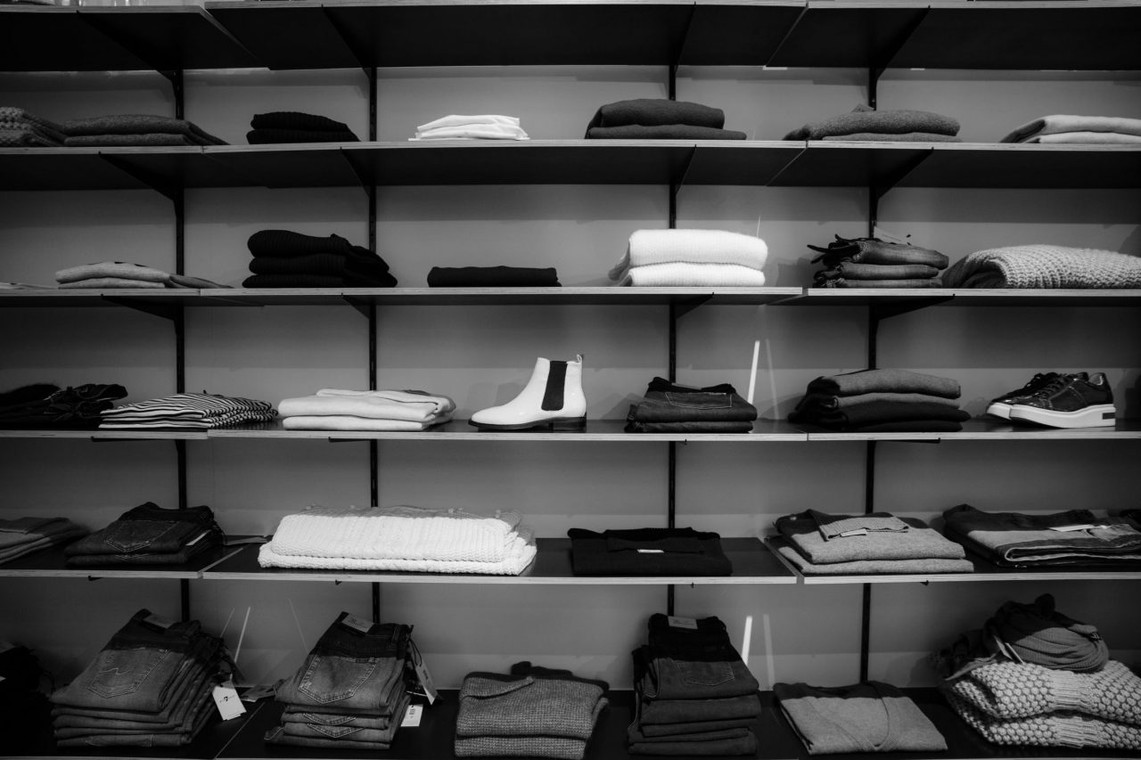 designer clothes on a shelf