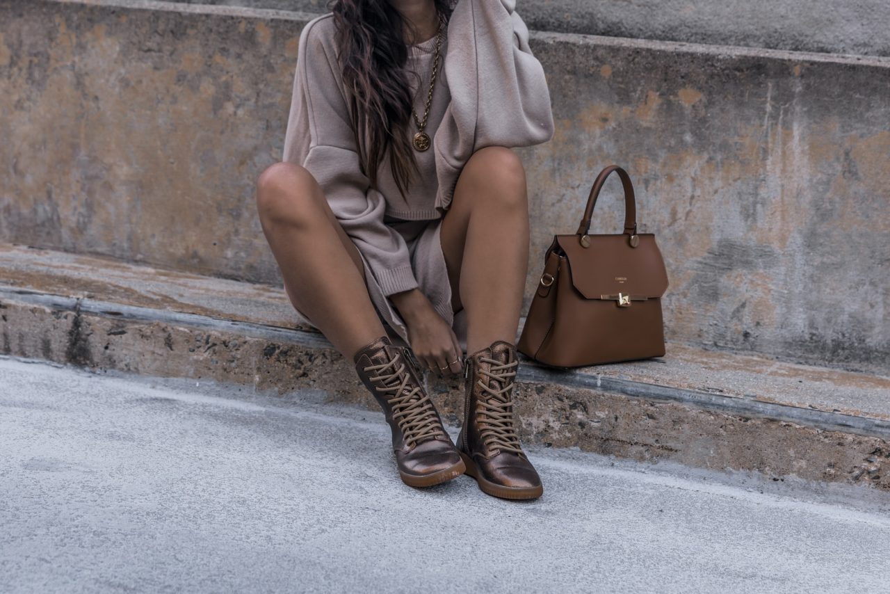 woman sitting with handbag