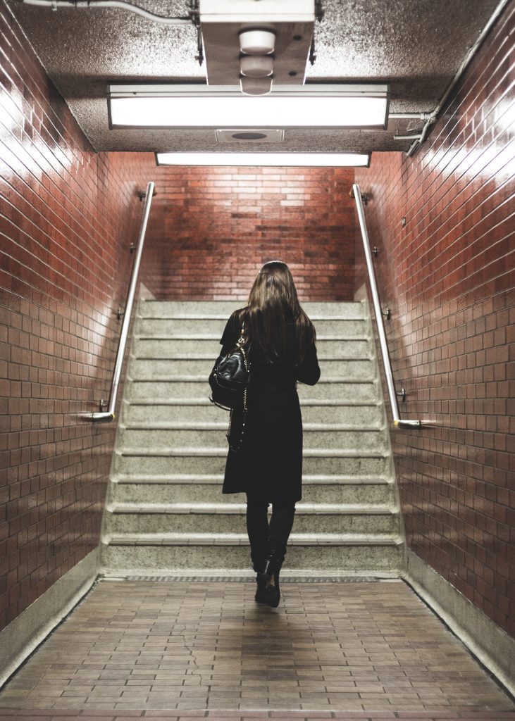 woman walking with bag